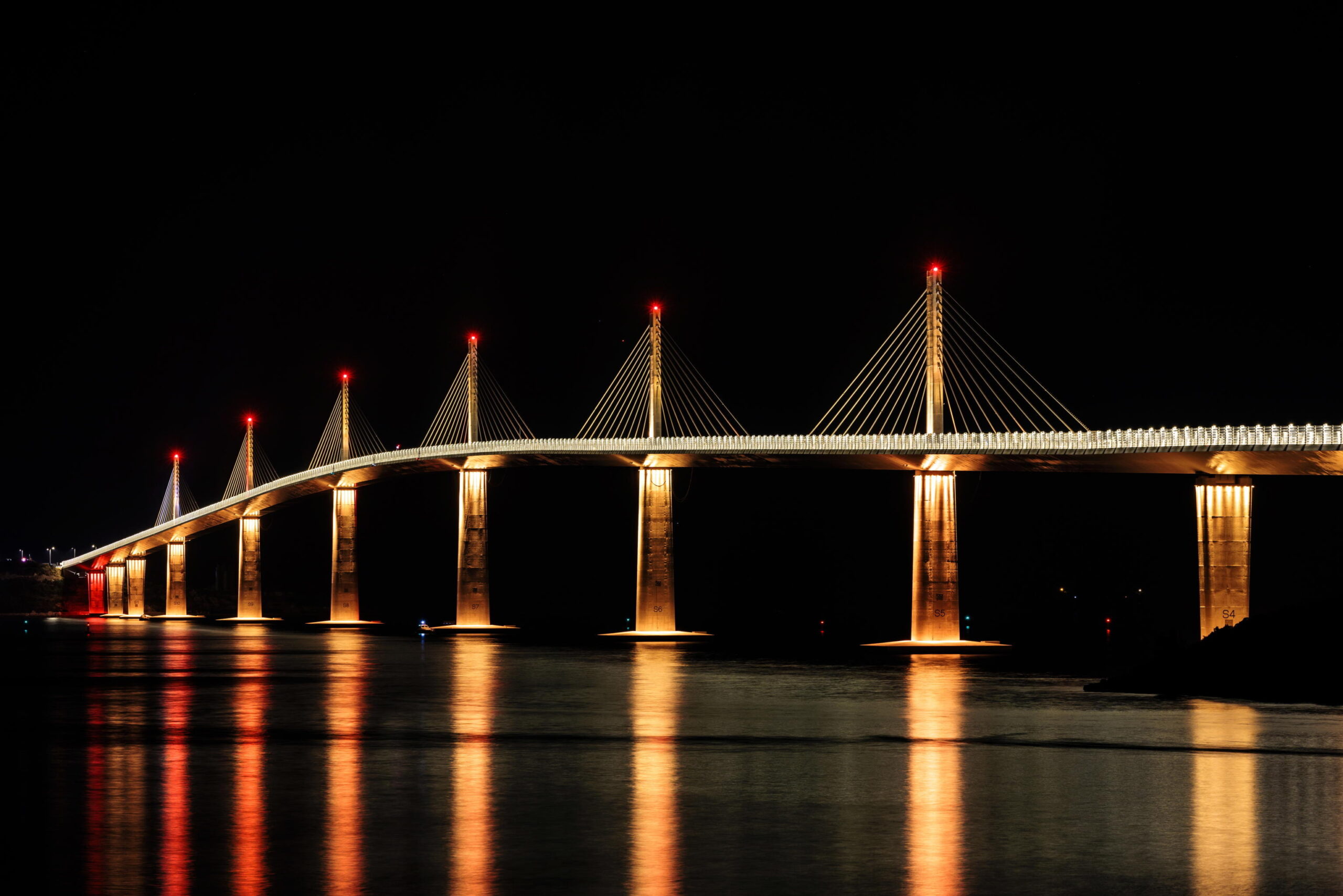 epa10092941 A view of Peljesac' Bridge at Komarna village, during the opening ceremony, Croatia, 26 July 2022. Croatian authorities are opening the bridge with all day celebration and it will open for traffic in the evening with a ceremony. Croatia started two and half years ago to construct a new bridge together with a Chinese company to achieve the territorial continuity of Croatia by connecting the southern exclave compromising the bulk of Dubrovnik -Neretva County with the remainder of the Croatian mainland. The 2404 meters-long bridge will span the Peljesac peninsula channel with Komarna village and when done travelers will not need to use the Bosnian territory to cross from one part of Croatia to another. The bridge official name 'Peljesac bridge' will open for traffic on 26 July 2022. The bridge cost some 275.000.000 euros for which Croatia used EU funds. EPA/STRINGER
