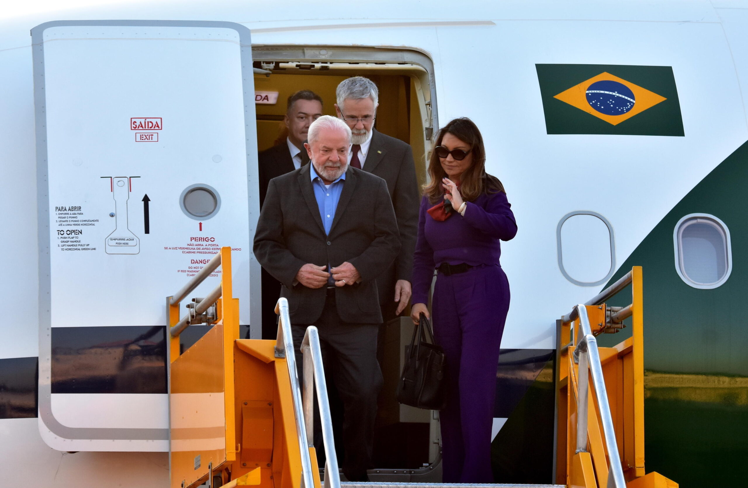 epa10800540 The President of Brazil, Luiz Inacio Lula da Silva (L), accompanied by his wife, Rosangela da Silva (R) arrive at Silvio Pettirossi International Airport, in Luque, Paraguay, 14 August 2023. Lula da Silva arrived in Paraguay to participate in the investiture of Santiago Pena as the new President of Paraguay. In addition, according to his official agenda, he will also hold a private meeting with former President and Senator Fernando Lugo (2008-2012), who is recovering from a cardiovascular accident he suffered in August of last year.  EPA/Daniel Piris