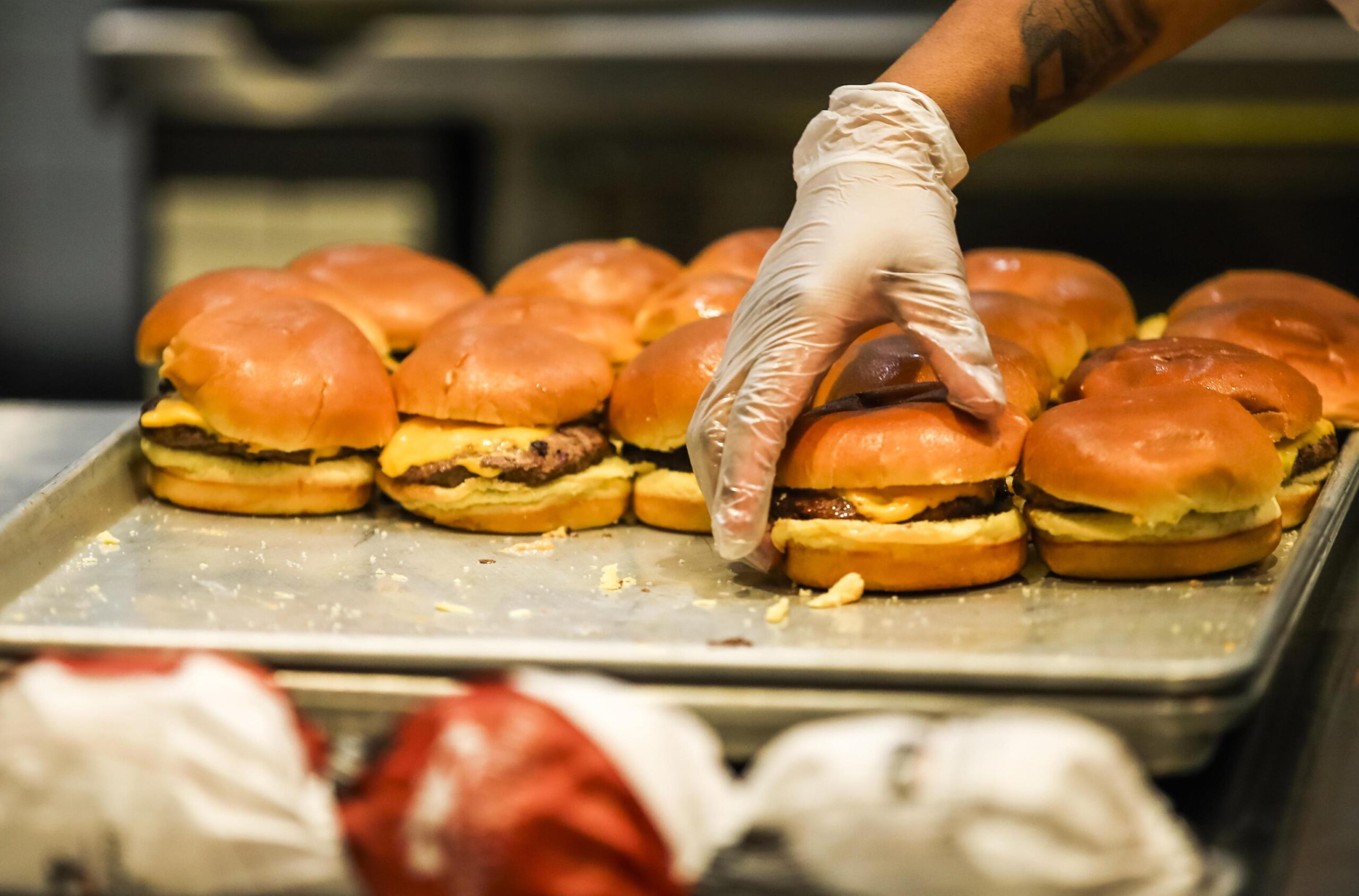 epa07330410 Cheeseburgers are prepared in the Mercedes-Benz Stadium as preparations for Super Bowl LIII continue in Atlanta, Georgia, USA, 29 January 2019. The New England Patriots will face the Los Angeles Rams on 03 February in Super Bowl LIII.  EPA/TANNEN MAURY