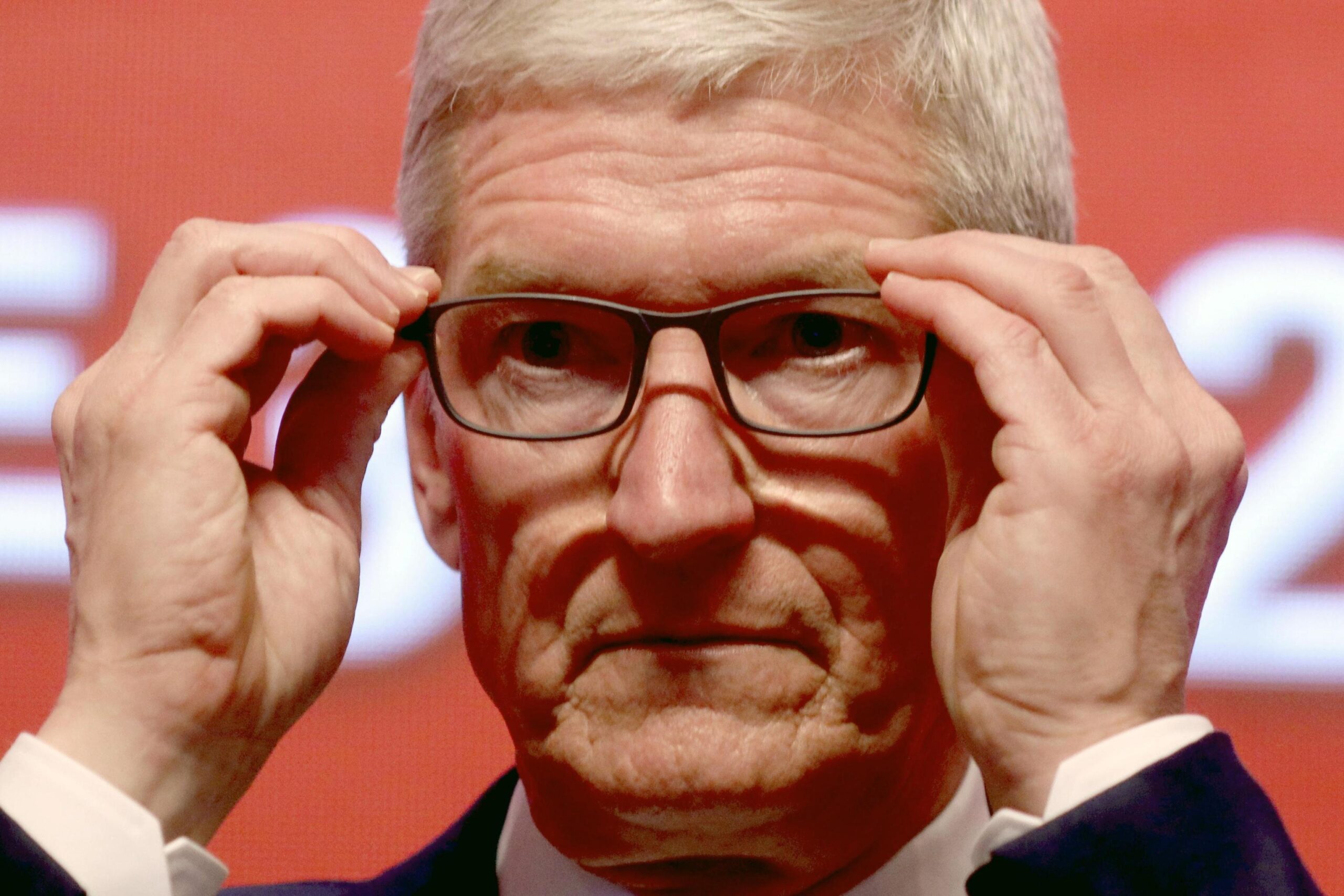 epa07457633 Apple CEO Tim Cook reacts during the Economic Summit held for the China Development Forum in Beijing, China, 23 March 2019. During the event Cook urged China to open up its economy.  EPA/NG HAN GUAN / POOL